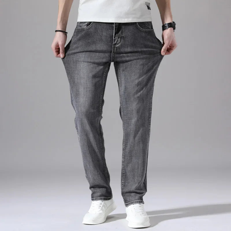Pantalones vaqueros elásticos de algodón para hombre, Vaqueros de mezclilla finos informales de negocios, color gris, primavera y verano, nuevo ajuste recto y ligero