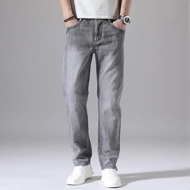Pantalones vaqueros elásticos de algodón para hombre, Vaqueros de mezclilla finos informales de negocios, color gris, primavera y verano, nuevo ajuste recto y ligero